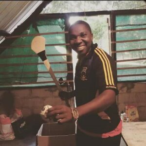 Zimbabwean SERVE volunteer Vernam Timbini wearing his Tipperary Ladies training top.